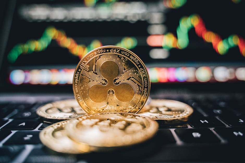 Golden Ripple XRP coins on laptop, symbolizing cryptocurrency trends and online trading